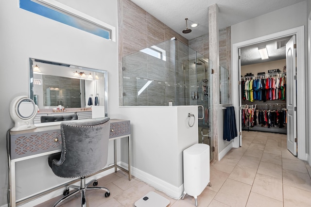 bathroom featuring tile patterned flooring, a textured ceiling, and walk in shower