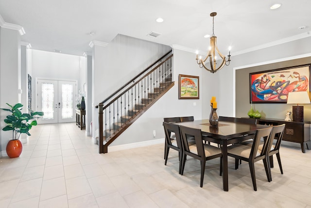 dining room featuring french doors, a notable chandelier, visible vents, ornamental molding, and stairs