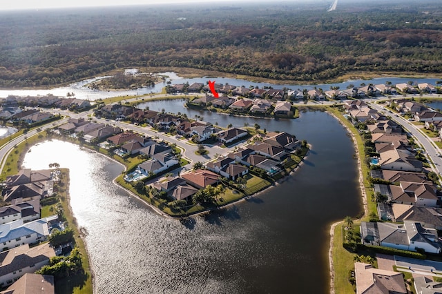 bird's eye view featuring a water view and a residential view