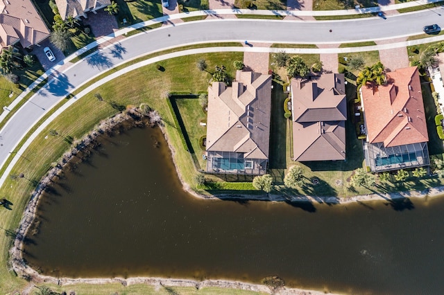 birds eye view of property with a residential view and a water view