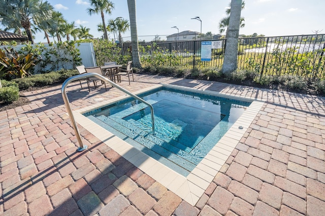 view of pool featuring a community hot tub