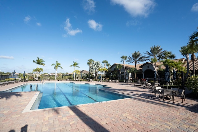 view of swimming pool featuring a patio area