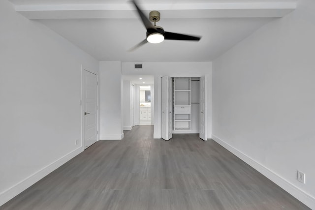 unfurnished bedroom with a ceiling fan, visible vents, baseboards, and wood finished floors