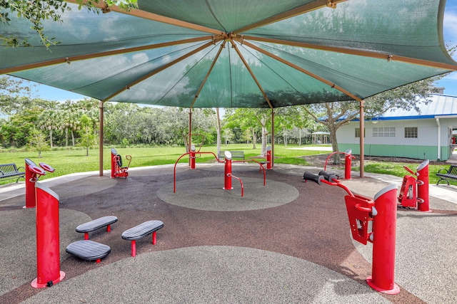 view of home's community featuring playground community and a lawn