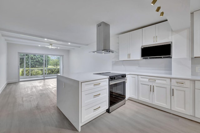 kitchen featuring light countertops, electric range, white cabinets, and island range hood