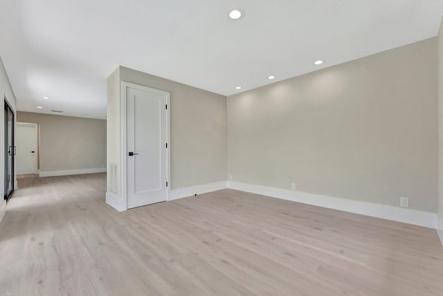 unfurnished room featuring light hardwood / wood-style floors