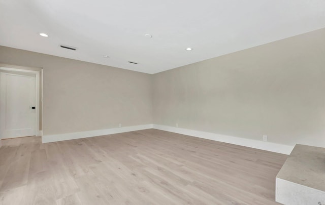 unfurnished room featuring light hardwood / wood-style floors