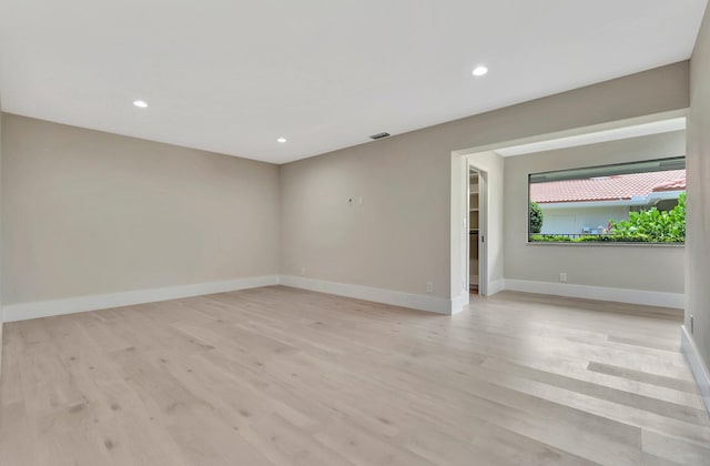 spare room with light wood-type flooring