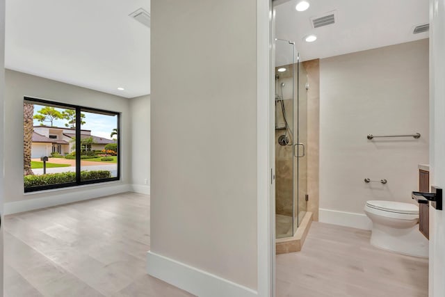 bathroom with toilet and walk in shower