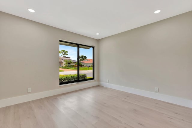 spare room featuring light hardwood / wood-style floors