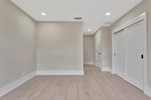 spare room featuring light hardwood / wood-style floors