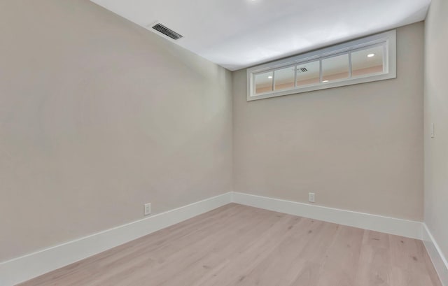 empty room with light hardwood / wood-style floors