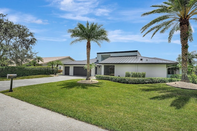 ranch-style home with a front lawn and a garage