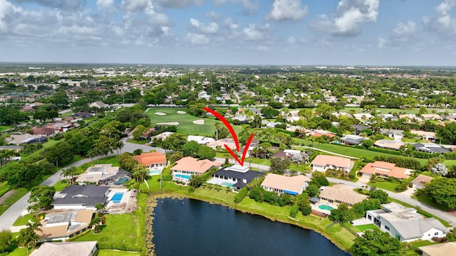 birds eye view of property featuring a water view