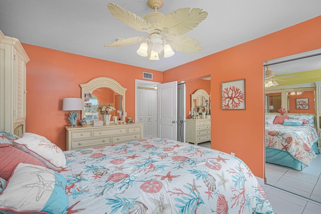 tiled bedroom with ceiling fan