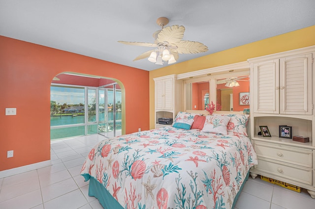 tiled bedroom with ceiling fan