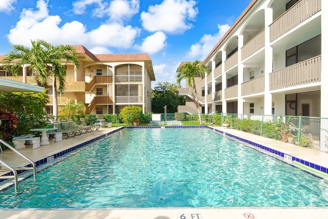 view of swimming pool featuring a patio area