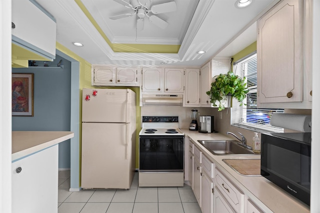 kitchen with white appliances, a raised ceiling, crown molding, sink, and light tile patterned flooring