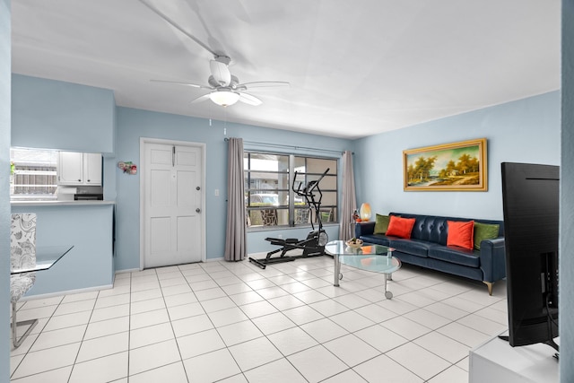 living room featuring ceiling fan and light tile patterned flooring