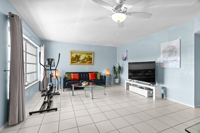 living room featuring ceiling fan and light tile patterned flooring