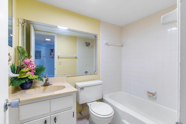 full bathroom featuring vanity, toilet, and tiled shower / bath combo