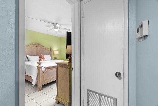 tiled bedroom with ceiling fan