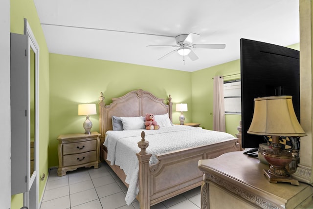 tiled bedroom featuring ceiling fan