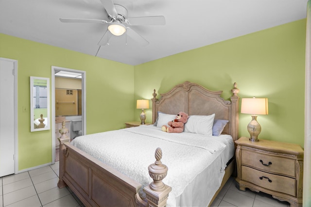 bedroom featuring ceiling fan, light tile patterned floors, and ensuite bath