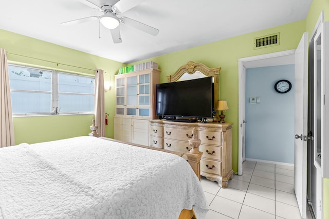 bedroom featuring ceiling fan and light tile patterned floors