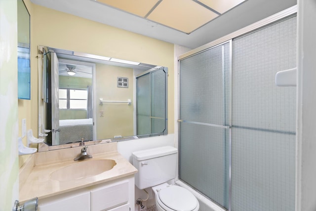 bathroom featuring vanity, toilet, and an enclosed shower