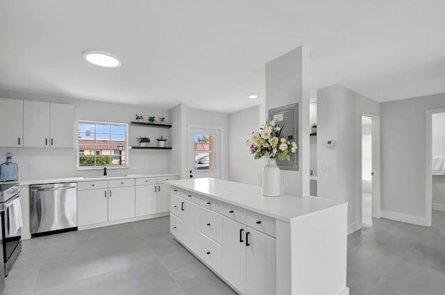 kitchen featuring white cabinets, dishwasher, and a center island