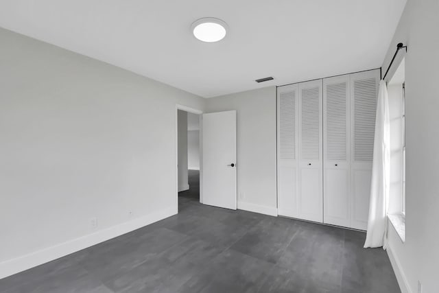 unfurnished bedroom featuring a closet