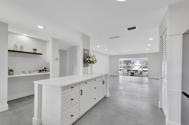 kitchen featuring white cabinets