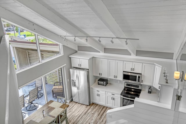 kitchen with track lighting, light hardwood / wood-style flooring, white cabinetry, stainless steel appliances, and wood ceiling