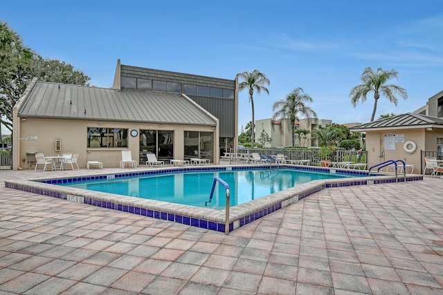 view of swimming pool with a patio