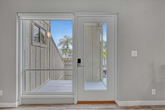 doorway to outside featuring hardwood / wood-style flooring