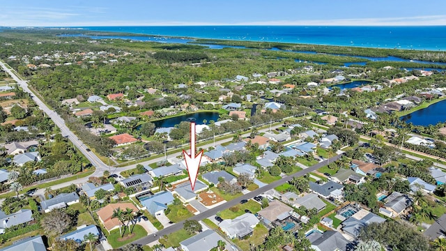 drone / aerial view with a water view