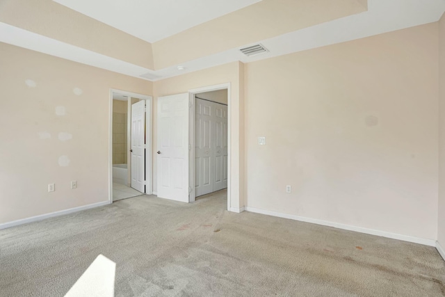 901 SW 15th St, Deerfield Beach, FL 33441 - unfurnished bedroom featuring light colored carpet, baseboards, and ensuite bath