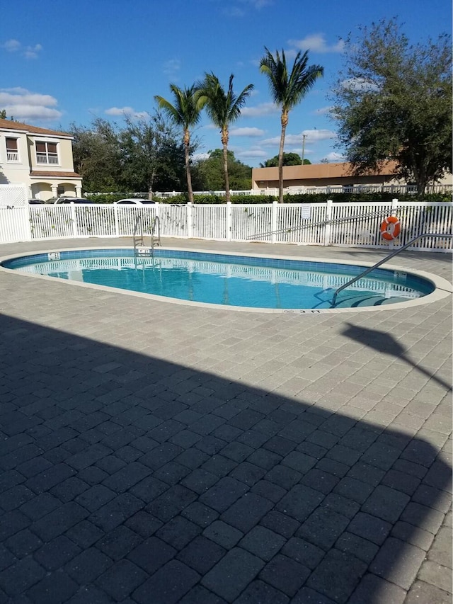 view of swimming pool with a patio area