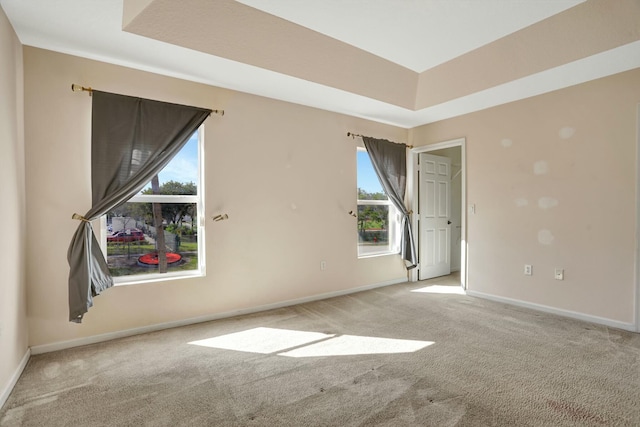 901 SW 15th St, Deerfield Beach, FL 33441 - carpeted spare room featuring baseboards and a raised ceiling