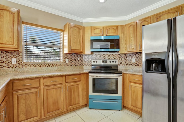 901 SW 15th St, Deerfield Beach, FL 33441 - kitchen featuring appliances with stainless steel finishes, light tile patterned flooring, crown molding, light countertops, and tasteful backsplash