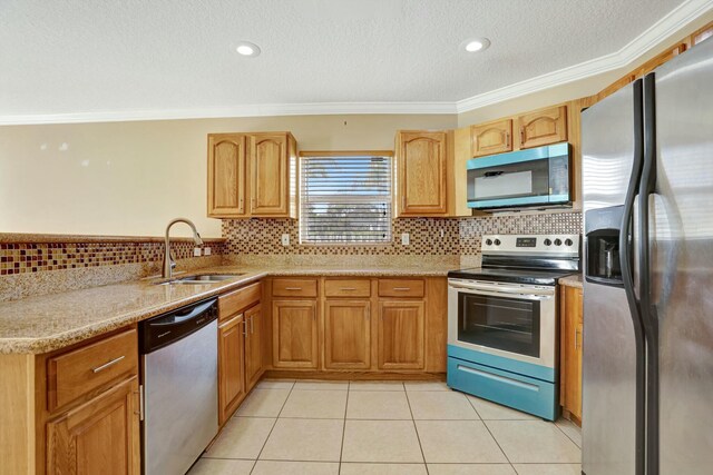 kitchen featuring tasteful backsplash, light tile patterned floors, stainless steel appliances, and ornamental molding