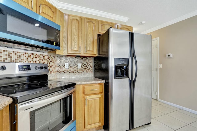 901 SW 15th St, Deerfield Beach, FL 33441 - kitchen featuring appliances with stainless steel finishes, ornamental molding, decorative backsplash, light tile patterned floors, and baseboards