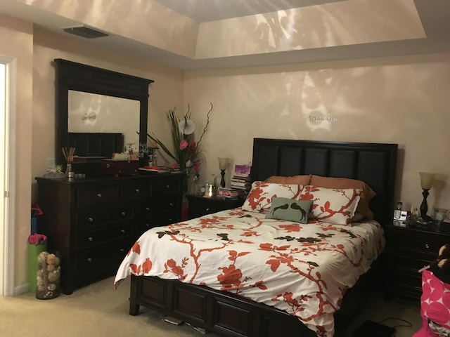 bedroom featuring light colored carpet