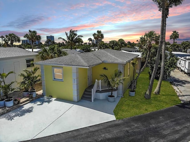 view of front of home with a yard