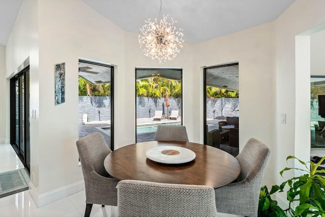 dining room featuring a notable chandelier and light tile patterned floors