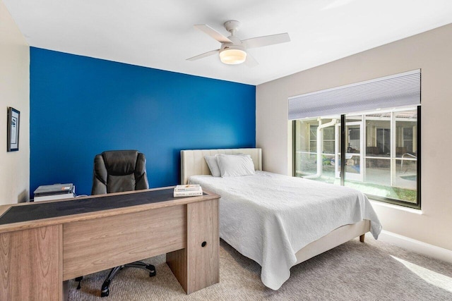 carpeted bedroom featuring ceiling fan