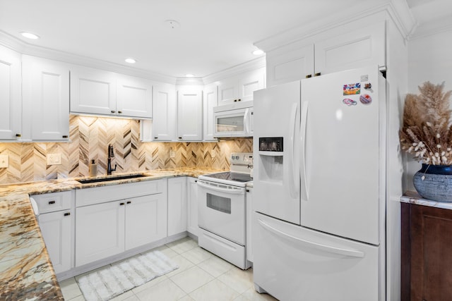 kitchen featuring white cabinetry, sink, light tile patterned floors, and white appliances