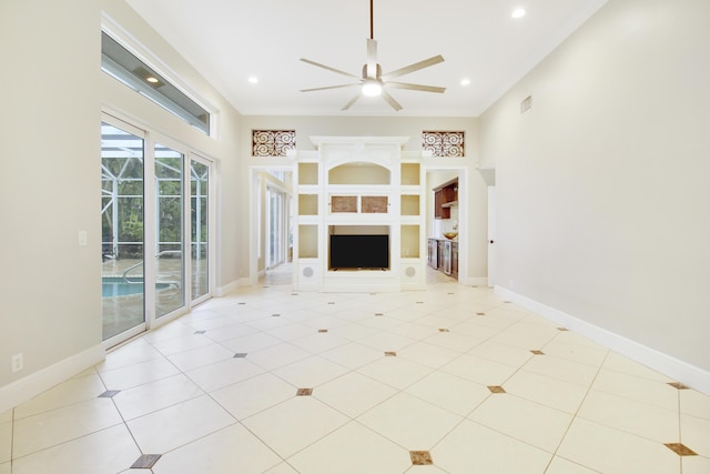 unfurnished living room with ceiling fan, light tile patterned floors, and a fireplace