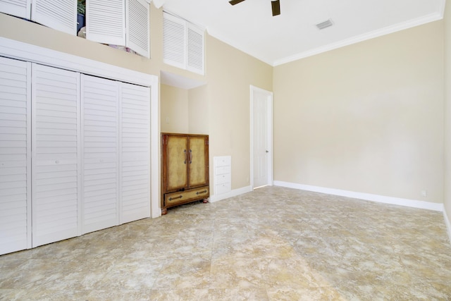 unfurnished living room featuring ceiling fan and ornamental molding